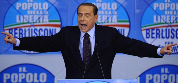 Italy's Prime Minister Silvio Berlusconi gestures as he speaks during an electoral meeting of the "People of Liberty" party for communal elections in Arcore on May 9, 2011. AFP PHOTO / OLIVIER MORIN (Photo credit should read OLIVIER MORIN/AFP/Getty Images)