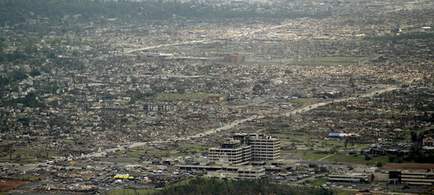 A destroyed neighborhood is seen in Joplin, Mo. Tuesday, May 24, 2011. A large tornado moved through much of the city Sunday, damaging a hospital and hundreds of homes and businesses. (AP Photo/Charlie Riedel)