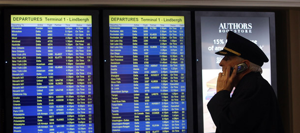 MINNEAPOLIS, MN - MARCH 23: A pilot checks out flight delays at the Minneapolis St. Paul International Airport on March 23, 2011 in Minneapolis, Minnesota. The snow storm is causing travel delays throughout the northern midwest. (Photo by Bruce Bennett/Getty Images)