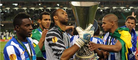 (FromL, in foreground) FC Porto's forward Silvestre Varela, Brazilian goalkeeper and captain Helton and Brazilian midfielder Fernando celebrate their victory with the trophy at the end of the UEFA Europa League final football match FC Porto vs SC Braga on May 18, 2011 at the Aviva Stadium in Dublin. FC Porto won 1-0. AFP PHOTO/ FRANCISCO LEONG (Photo credit should read FRANCISCO LEONG/AFP/Getty Images)