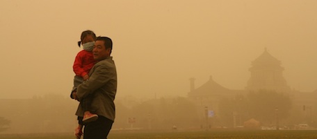 CHANGCHUN, CHINA - MAY 12: (CHINA OUT) People wearing masks walk in the sandstorm on May 12, 2011 in Jilin Province of China. A sandstorm hits Northeast China on Thursday. (Photo by ChinaFotoPress/Getty Images)