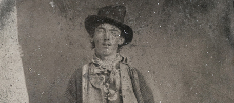 This photograph provided by Old West Show and Auction shows a photograph of a tintype of Billy the Kid taken in 1879 or 1880 in Fort Sumner, N.M. It shows the outlaw standing with his hand resting on a Winchester rifle on one side and a Colt revolver holstered on his right side. The tintype is to be auctioned in Denver on Saturday night and expected to bring between $300,000 to $400,000. (AP Photo/Old West Show and Auction)