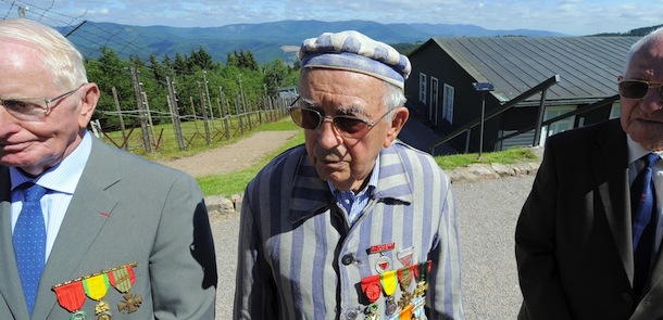 Former deportees attend a ceremony on June 26, 2011 at the Struthof WWII concentration camp, in Natzwiller, eastern France, only Nazi death camp on French soil. Some 22,000 men and women perished at the Struthof death camp between May 1941 and November 1944, when it was liberated by US forces. Most of the victims were members of the resistance and political deportees. AFP PHOTO / PATRICK HERTZOG (Photo credit should read PATRICK HERTZOG/AFP/Getty Images)
