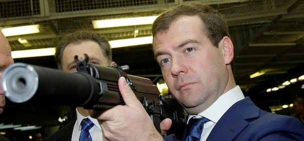 President Vladimir Putin's likely successor Dmitry Medvedev holds a Kalashnikov gun as he visits a plant manufacturing Kalashnikovs assault rifles and other fire-arms in the central Russian city of Izhevsk, about 1000 kilometers (625 miles) east of Moscow, Tuesday, Feb. 19, 2008. (AP Photo/Alexander Zemlianichenko, pool)