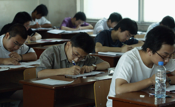 XIAN, CHINA - JUNE 7: (CHINA OUT; PHOTOCOME OUT) Students take part in the college entrance exam at an exam room in a middle school on June 7, 2005 in Xian of Shaanxi Province, China. About 8.67 million students will sit the national entrance examination for college this year. The target number of full time higher education enrolments for 2005 is 4.75 million, an 8 percent increase on 2004. (Photo by China Photos/Getty Images)