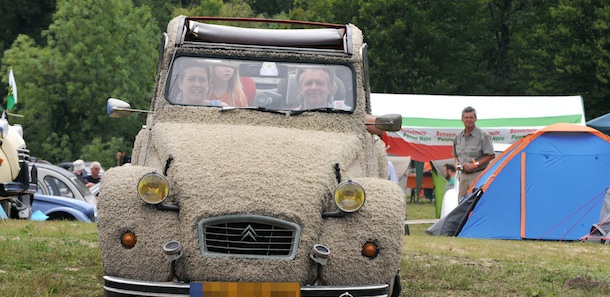 People from the Netherlands drive their customized Citroen 2CV car on July 27, 2011 in the French western city of Salbris, during the 19th World meeting of 2 CV Friends that takes place until the July 31. In 2006, on this same site, more than 2650 2CVs and A-types gathered for the 14th National Meeting of French 2 CV Clubs. AFP PHOTO/ALAIN JOCARD (Photo credit should read ALAIN JOCARD/AFP/Getty Images)
