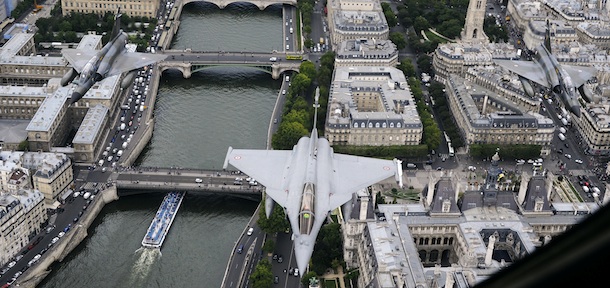 Picture taken on July 6, 2011 of a French Rafale jet (C) flying over the Seine river in Paris and flanked by two Mirage 2000-N during a rehearsal of the Bastille Day military parade scheduled on July 14. AFP PHOTO / ANNE-CHRISTINE POUJOULAT (Photo credit should read ANNE-CHRISTINE POUJOULAT/AFP/Getty Images)