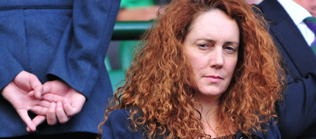 Chief Executive of News International and former editor of Britain's News of the World newspaper Rebekah Brooks (Top L) attends the semi final match between Serbian player Novak Djokovic and French player Jo-Wilfried Tsonga during the Wimbledon Tennis Championships at the All England Tennis Club, in south-west London, on July 1, 2011. Britain's News of the World tabloid will print its last ever edition on Sunday July 10, 2011, following a scandal over phone hacking, owner Rupert Murdoch's son James Murdoch said Thursday July 7, 2011. AFP PHOTO/LEON NEAL/RESTRICTED TO EDITORIAL USE (Photo credit should read LEON NEAL/AFP/Getty Images)
