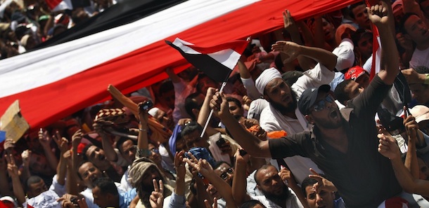 Egyptian protesters chant Islamic slogans during a demonstration after Friday prayers in Tahrir Square, Cairo, Friday July 29, 2011, where many have set up protest tent camps in the main city square. Egyptians rallied in Cairo's central Tahrir Square on Friday seeking to unify their demands despite rifts over key issues between liberal activists and Islamist groups. (AP Photo/Khalil Hamra)