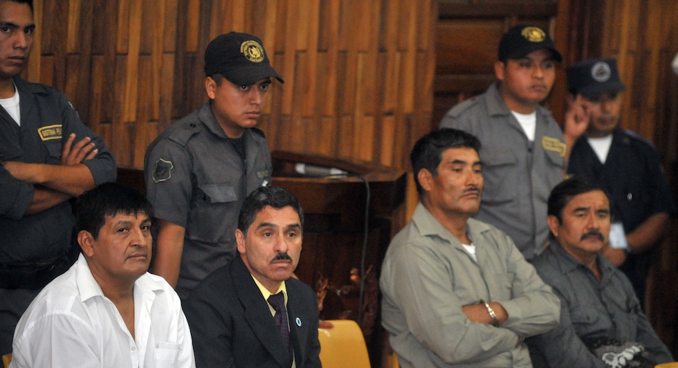 (L to R) Daniel Martinez, Carlos Carias, Manuel Pop and Reyes Collin, four military men accused of an extra-judiciary execution of 252 farmers in 1982, await in court during their trial, in Guatemala City, on July 25, 2011. The killing was one of the bloodiest slaughters during the 1960-96 civil war in Dos Erres village, in departament Peten, 600 km north of Guatemala City. AFP PHOTO/Johan ORDONEZ (Photo credit should read JOHAN ORDONEZ/AFP/Getty Images)