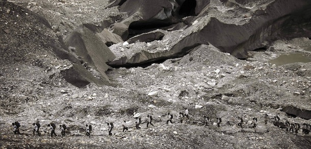 In this July 19, 2011 photo, Indian army soldiers return from the border posts to the Siachen base camp, in Indian Kashmir on the border with Pakistan. The nuclear-armed South Asian nations have competing territorial claims to Siachen, often dubbed the world's highest battlefield, and troops have been locked in a standoff there at an altitude of up to 20,000 feet (6,100-meter) since 1984, when Indian forces occupied the glacier. Indian and Pakistani foreign secretaries held talks Tuesday against the backdrop of a recent terror attack that killed 20 people in India's financial capital, ahead of the countries' foreign ministers meet Wednesday. (AP Photo/Channi Anand)