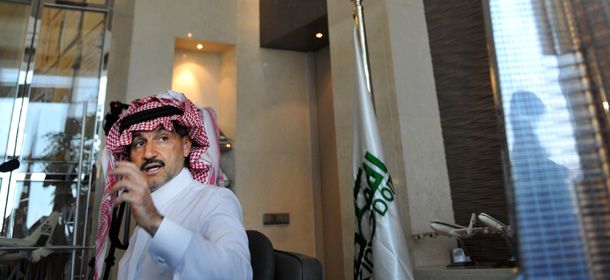 Saudi Prince Alwaleed bin Talal speaks next to a model of the world's tallest tower to be built in the Red Sea city of Jeddah during a press conference in Riyadh on August 2, 2011. The tower will exceed 1,000m (3,300 feet) and cost 4.6 billion riyals (1.2 billion US dollars) to build. AFP PHOTO/FAYEZ NURELDINE (Photo credit should read FAYEZ NURELDINE/AFP/Getty Images)