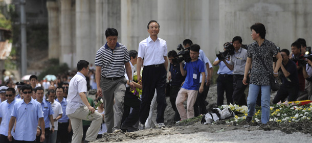 Chinese Premier Wen Jiabao, center, visits at the site of the Saturday July 23, 2011 train crash, in Wenzhou, east China's Zhejiang province, Thursday, July 28, 2011. Wen vowed Thursday to punish anyone involved if there was corruption that caused the high-speed train crash that killed more than 35 people, amid growing public resentment of the handling of the accident. (AP Photo) CHINA OUT