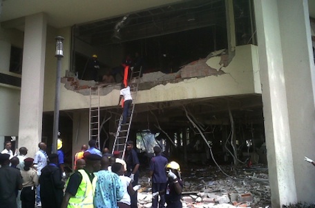 This image released by Saharareporters shows firefighters and rescue workers after a large explosion struck the United Nations' main office in Nigeria's capital Abuja Friday Aug. 26, 2011, flattening one wing of the building and killing several people. A U.N. official in Geneva called it a bomb attack. The building, located in the same neighborhood as the U.S. embassy and other diplomatic posts in Abuja, had a huge hole punched in it. (AP Photo/Saharareporters)
