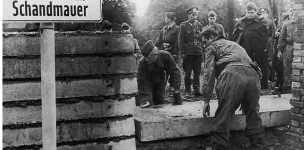 1961: Soldiers building the Berlin Wall as instructed by the East German authorities, in order to strengthen the existing barriers dividing East and West Berlin. (Photo by Keystone/Getty Images)