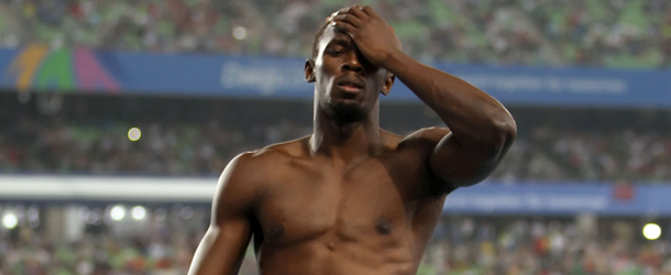 DAEGU, SOUTH KOREA - AUGUST 28: Usain Bolt of Jamaica shows his dejection after being disqualified for a false start in the Men's 100 metre final during day two of 13th IAAF World Athletics Championships at the Daegu Stadium on August 28, 2011 in Daegu, South Korea. (Photo by Michael Steele/Getty Images)