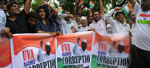 Indian supporters of 73-year old anti-corruption crusader Anna Hazare participate in a protest rally at Gandhi Ashram in Ahmedabad on August 15, 2011. A veteran Indian anti-corruption campaigner headed for a showdown with police when he vowed to court arrest after being banned from beginning a hunger strike in the capital New Delhi. AFP PHOTO / Sam PANTHAKY (Photo credit should read SAM PANTHAKY/AFP/Getty Images)