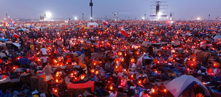 TORONTO, CANADA - JULY 27: People listen to Pope John Paul II during an evening candlelight vigil with World Youth Day pilgrams at Downsview Park July 27, 2002 in Toronto, Canada. World Youth Day, which has brought over 600,000 young people to Toronto, will conclude with Pope John Paul II in attendance at Sunday Mass. (Photo by Spencer Platt/Getty Images)
