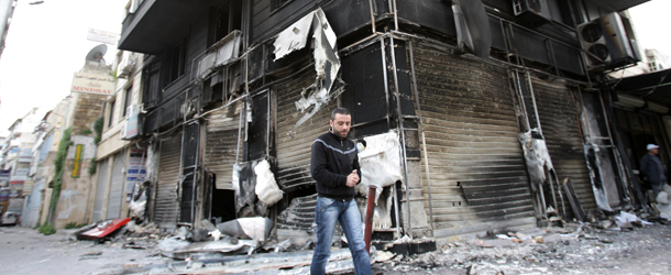A man walks past a burnt-out building in the Northern city of Latakia, some 350 km northwest Damascus on March 27, 2011. Syrian security forces strove to restore order in the northern city of Latakia, after two days of chaos that left 15 dead and more than 150 injured in a wave of unrest that has put President Bashar al-Assad under unprecedented pressure.
AFP PHOTO / ANWAR AMRO (Photo credit should read ANWAR AMRO/AFP/Getty Images)