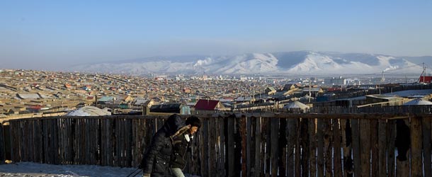 ULAAN BAATAR, MONGOLIA - MARCH 12: Mongolians carry jugs of water back to their home forced to walk in the cold to a water pipe where all the residents in the Ger district get their water on March 12, 2010 in Ulaan Baatar, Mongolia. Many Mongolians have immigrated to the capital city from the far away provinces seeking employment, living in rented traditional circular felt yurts with no running water or electricity. In the winter this means extreme hardship, with temperatures dropping below -25C mid- Winter. As Mongolia experiences extreme cold and snow struggling during the worst winter in 30 years. Presently the government has declared an emergency requiring foreign aid to alleviate the impact of the "Zud" ( Mongolian term for a multiple natural disaster) caused by bitter cold and thick snow. Currently 1.5 million goats, 921,000 sheep, 169,000 cows and yaks, 89,000 horses and 1,500 camels had died according to the various UN agency reports. (Photo by Paula Bronstein /Getty Images)