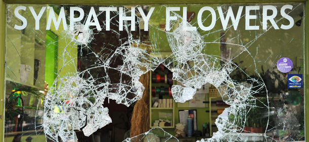 LONDON, ENGLAND - AUGUST 09: The smashed windows of a florist in Haven Green following a night of rioting in Ealing on August 9, 2011 in London, England. Sporadic looting, arson and clashes with police continued for a third day in parts of the capital, as well as in Liverpool, Birmingham and Bristol. (Photo by Jim Dyson/Getty Images)