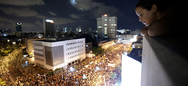 TEL AVIV, ISRAEL - AUGUST 06: (ISRAEL OUT) Thousands of people march in the streets during a protest against the rising cost of living on August 6, 2011 in Tel Aviv, Israel. Protests across Israel were spurred following a Knesset vote to approve the national housing committees law, which places the authority for approving building projects in the hands of regional committees. (Photo by Uriel Sinai/Getty Images)