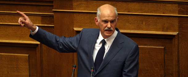 Prime Minister George Papandreou speaks to his lawmakers in the parliament in Athens on June 16, 2011. Papandreou appealed for unity from his own lawmakers to beat Greece&#8217;s debt crisis after two deputies quit and the IMF insisted there can be no back-sliding on agreed cuts. AFP PHOTO / Panagiotis Tzamaros (Photo credit should read Panagiotis Tzamaros/AFP/Getty Images)
