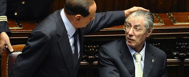 Italian Prime Minister Silvio Berlusconi (L) touches Reforme Minister Umberto Bossi (R) upon arrival at the Chamber of Deputies in Rome on September 22, 2011 for a parliamentary vote on the arrest of Marco Milanese, a former aide to Finance Minister Giulio Tremonti,and to test his government&#8217;s unity as it fights to survive Europe&#8217;s debt crisis. The lower house is set to vote in a secret ballot on a request by prosecutors to grant the arrest of Marco Milanese, a ruling-party lawmaker accused of corruption. AFP PHOTO / VINCENZO PINTO (Photo credit should read VINCENZO PINTO/AFP/Getty Images)
