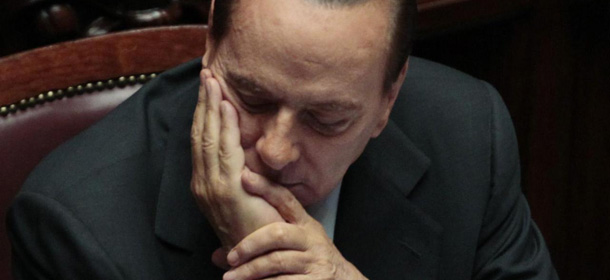 Italian Premier Silvio Berlusconi reacts prior to the start of a voting session on Government&#8217;s austerity package in Rome, Wednesday, Sept. 14, 2011. (AP Photo/Gregorio Borgia)
