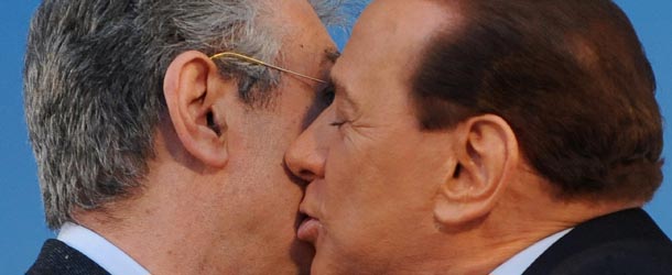 Italian Prime Minister and President of the PDL Silvio Berlusconi (R) kisses the leader of the right-wing Northern League Umberto Bossi during a pre-electoral rally of his center-right party "Popolo della Liberta" (PDL) on March 20, 2010 in Rome. The media tycoon has said the elections in 13 of Italy's 20 regions on March 28 and 29 will be a key barometer of his centre-right coalition's performance since he returned to power for a third time in 2008. The Berlusconi camp is on the defensive after being hit by a series of embarrassments as top officials were caught up in corruption scandals. AFP PHOTO / TIZIANA FABI (Photo credit should read TIZIANA FABI/AFP/Getty Images)
