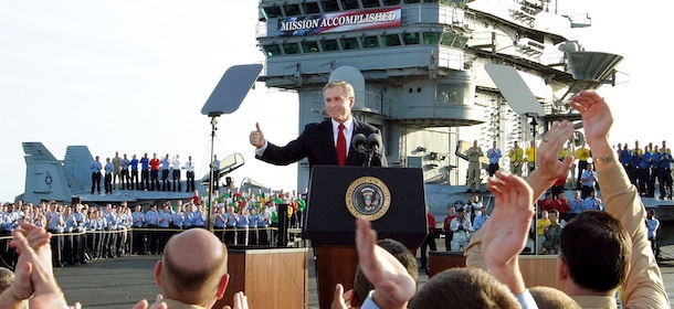 ** FILE ** In this May 1, 2003 file photo, President Bush gives a "thumbs-up" sign after declaring the end of major combat in Iraq as he speaks aboard the aircraft carrier USS Abraham Lincoln off the California coast. (AP Photo/J. Scott Applewhite, File)