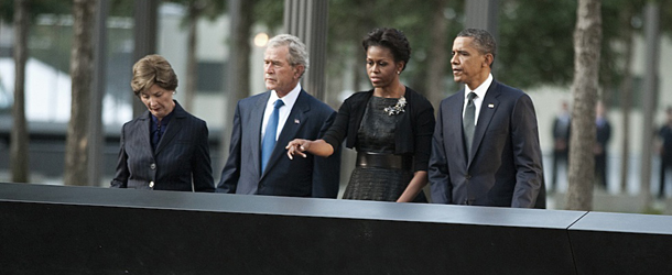 US President Barack Obama (R) First Lady Michelle Obama, former President George W. Bush and former First Lady Laura Bush(L) at the memorial wall on the North Tower reflecting pool of the World Trade Center September 11, 2011 in New York. AFP PHOTO/DON EMMERT (Photo credit should read DON EMMERT/AFP/Getty Images)