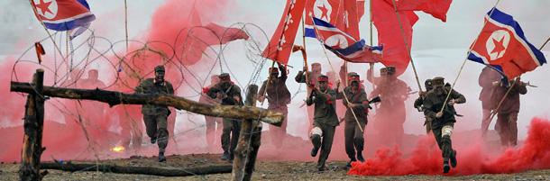 South Korean soldiers play the roles of invading North Korean soldiers during a re-enactment of the 1950 battle of Nakdong River to mark its 61th anniversary in Chilgok, about 290 kms southeast of Seoul, on September 29, 2011. The Korean peninsula is the world&#8217;s last Cold War frontier as Stalinst North Korea and pro-Western South Korea have been technically at war since the 1950-53 conflict. AFP PHOTO/JUNG YEON-JE (Photo credit should read JUNG YEON-JE/AFP/Getty Images)
