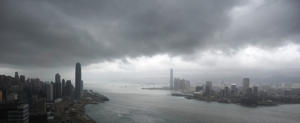 Low dark cloud hangs over an empty Victoria Harbour in the morning during a Typhoon 8 Signal Warning as Typhoon Nesat passed close to Hong Kong on September 29, 2011. Hong Kong locked down on September 29, suspending financial markets, schools and transport services as strong winds from the deadly typhoon Nesat brought disruption to the city. AFP PHOTO / ED JONES (Photo credit should read Ed Jones/AFP/Getty Images)

