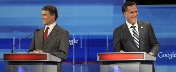 ORLANDO, FL &#8211; SEPTEMBER 22: Republican presidential candidates, Texas Gov. Rick Perry (L) and former Massachusetts Gov. Mitt Romney laugh during the Fox News/Google GOP Debate at the Orange County 
Convention Center on September 22, 2011 in Orlando, Florida. The debate featured the nine 
Republican candidates two days before the Florida straw poll. (Photo by Phelan M. Ebenhack-Pool/Getty Images)
