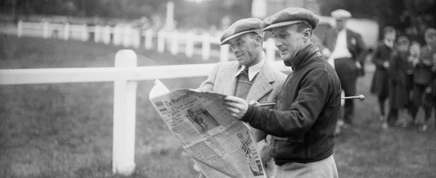 June 1936: Two jockeys, Michael Beary and Billy Nevett reading the race card at Royal Ascot. (Photo by Fox Photos/Getty Images)
