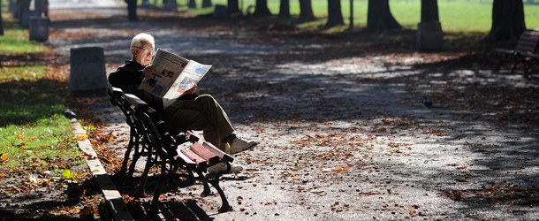 A man reads a newspaper in a park in the center of Sofia on October 22, 2010. AFP PHOTO / DIMITAR DILKOFF (Photo credit should read DIMITAR DILKOFF/AFP/Getty Images)
