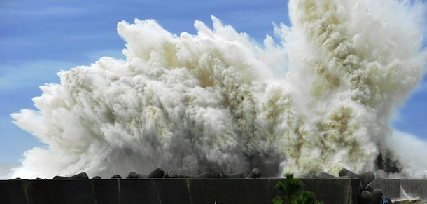 Surging waves hit against the breakwater in Udono in a port town of Kiho, Mie Prefecture, central Japan, Wednesday, Sept. 21, 2011. A powerful typhoon was bearing down on Japan&#8217;s tsunami-ravaged northeastern coast Wednesday, approaching a nuclear power plant crippled in that disaster and prompting calls for the evacuation of more than a million people. (AP Photo/Chunichi Shimbun, Daiji Yanagida) JAPAN OUT, MANDATORY CREDIT, NO SALES
