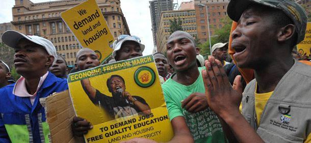 Some 2000 people demonstrate on October 27, 2011 in a square in downtown Johannesburg to demand jobs, in a protest organised by the militant youth wing of the ruling African National Congress (ANC). Protesters were bused in from around the country to support the Youth League leader Julius Malema, who accuses his party&#8217;s government of not doing enough to create jobs in a country with 25.7 percent unemployment. AFP PHOTO / ALEXANDER JOE (Photo credit should read ALEXANDER JOE/AFP/Getty Images)
