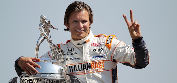 Dan Wheldon of England, driver of the #98 William Rast-Curb/Big Machine Dallara Honda poses with Borg Warner Trophy on the yard of bricks during the 95th Indianapolis 500 Mile Race Trophy Presentation at Indianapolis Motor Speedway on May 30, 2011 in Indianapolis, Indiana.
