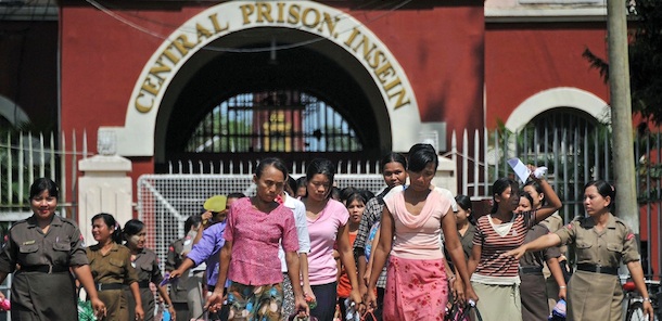 Myanmar female prisoners walk out of the Insein central prison in Yangon on October 12, 2011. Myanmar started to free dozens of prisoners on October 12, including political detainees among whom a comedian who is one of its most famous dissidents, in a further sign of change in the authoritarian state after decades of repression. The release of roughly 2,000 political detainees including pro-democracy campaigners, journalists, monks and lawyers, has long been a key demand of Western powers that have imposed sanctions on the country also known as Burma. AFP PHOTO/Soe Than WIN (Photo credit should read Soe Than WIN/AFP/Getty Images)
