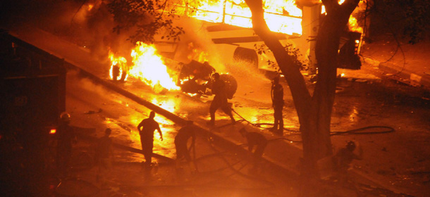 Egyptian security forces respond to a burning vehicle during clashes with protesters in Cairo Egypt, Sunday, Oct. 9, 2011. Fierce clashes erupted Sunday between Christians protesting a recent attack on a church and the Egyptian military, leaving more than a dozen people dead and scores injured, Health Ministry officials said. (AP Photo)
