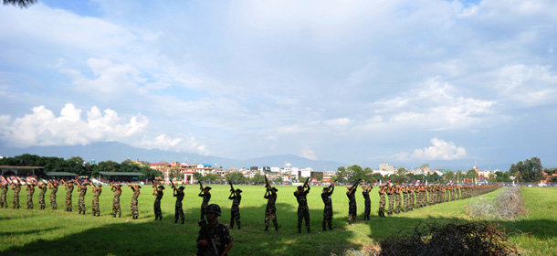 Nepalese army soldiers fire a volley of shots in salute during the Fulpati Parade in Kathmandu on October 3, 2011, held to mark the seventh day of the Dashain Festival. Hindus across the Himalayan nation are celebrating the 15-day long festival which involves the sacrifice of animals in honour of the Hindu goddess Durga. AFP PHOTO/Prakash MATHEMA (Photo credit should read PRAKASH MATHEMA/AFP/Getty Images)
