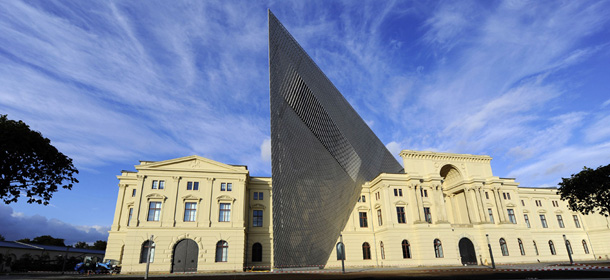 The Saturday, Oct. 8, 2011 photo shows Dresden&#8217;s, eastern Germany, Museum of Military History that is to be reopened after a dramatic redesign by American architect Daniel Libeskind. Libeskind added a massive five-story wedge of glass, concrete and steel that rips through the former armory built for the armies of Kaiser Wilhelm I, interrupting the symmetry of the neo-Classical building as a symbol of how German democracy has pushed aside the authoritarian past. (AP Photo/dapd, Matthias Rietschel)
