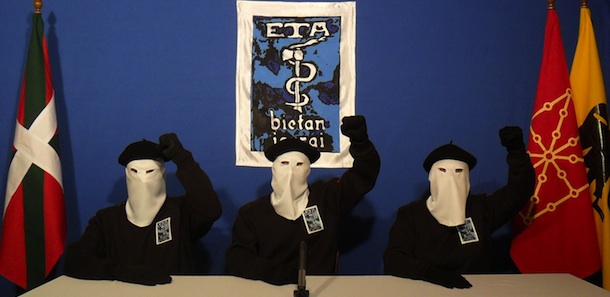 UNSPECIFIED &#8211; UNDATED: In this undated image provided by Gara, three Eta militants pose in front of the group&#8217;s symbol of a snake coiled around an axe, in support of a declaration released on October 20, 2011 stating a &#8220;definitive cessation&#8221; to it&#8217;s four decade long campaign of armed conflict in seeking an independent Basque homeland from Spain and France. (Photo released by Gara via Getty Images)
