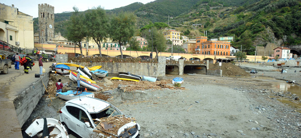 Cars and boats wrecks are covered with mud in the small town of Monterosso in the Italian north-western region of Liguria, Thursday, Oct. 27, 2011, following violent rains and floods that struck in the area. Soldiers and civilian rescue workers battled knee-deep mud Thursday as they searched for survivors after flash floods and mudslides inundated picturesque villages around coastal areas of Liguria and Tuscany. (Ap Photo/Massimo Pinca)
