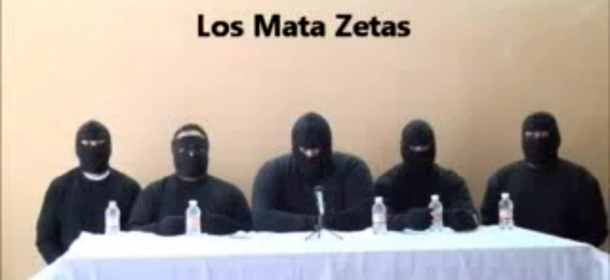 Screen capture of a paramilitary group which vowed to &#8220;eliminate&#8221; the Zetas, reputedly Mexico&#8217;s most violent drug gang, in a video posted on the Internet on September 24, 2011 several days after 49 bodies were found on the streets of Veracruz. The video, according to its creators, shows a group of masked men, dressed in black and seated at a white table, calling themselves the &#8220;Mata Zetas,&#8221; or &#8220;Kill Zetas.&#8221; &#8220;Our intention is to let the people of Veracruz know that these dregs of society are not invincible,&#8221; one of them says after offering &#8220;apologies&#8221; to the public and the authorities. AFP PHOTO / &#8211; (Photo credit should read -/AFP/Getty Images)
