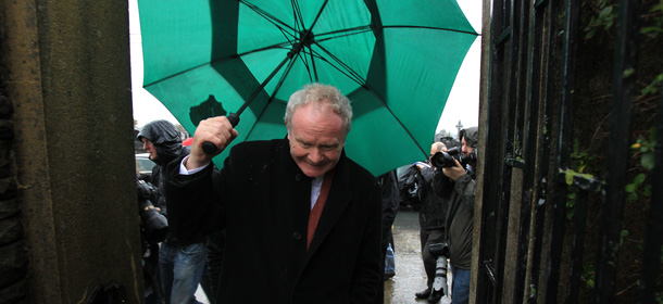 Sinn Fein presidential candidate Martin McGuinness gets caught in the front gate with his umbella after speaking with the media outside Our Lady of Lourdes Hospital in Drogheda, Ireland on October 25, 2011 during his final two days of canvassing. Voters go to the polls on October 27 to elect a new President.
AFP PHOTO/PETER MUHLY (Photo credit should read PETER MUHLY/AFP/Getty Images)
