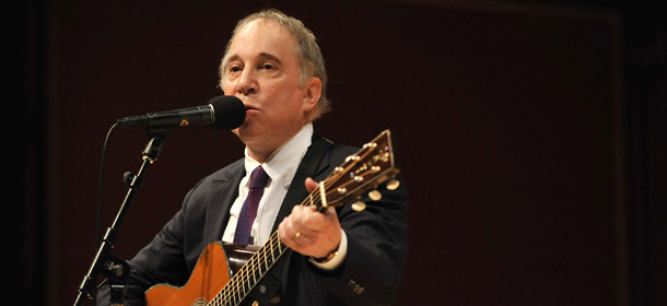 Musician Paul Simon, plays at the conclusion of the induction ceremony for the American Academy of Arts and Sciences, At Harvard University, in Cambridge, Mass., Saturday, Oct. 1, 2011. Simon was among the 179 influential artists, scientists and institutional leaders inducted into the American Academy of Arts and Sciences. (AP Photo/Josh Reynolds)
