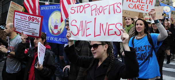 Occupy Wall Street supporters march calling for universal healthcare in New York, October 26, 2011. Physicians, nurses, community groups and supporters of healthcare marched to call for an end of corporate greed in the health insurance industry. AFP PHOTO/Emmanuel Dunand (Photo credit should read EMMANUEL DUNAND/AFP/Getty Images)
